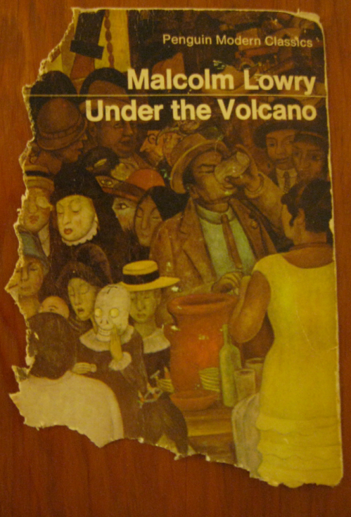 The cover alone of a paperback (Malcolm Lowry's Under the Volcano), the left and bottom edges are very rabbit-bitten
